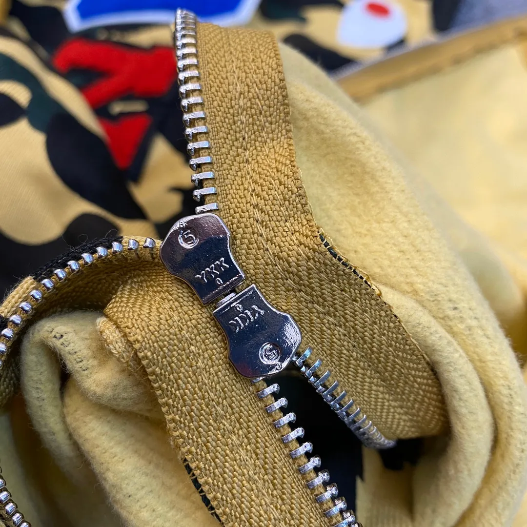 💰380 BAPE 1ST CAMO SHARK FULL Classic counter model Camouflage shark hooded zipper sweatshirt Machine-printed camouflage Top-quality fabric High-end 1:1 replica Customized fabric Couple model: S—XXL [Camouflage yellow, Camouflage green, Camouflage red, Camouflage purple, Camouflage blue, Camouflage gray]