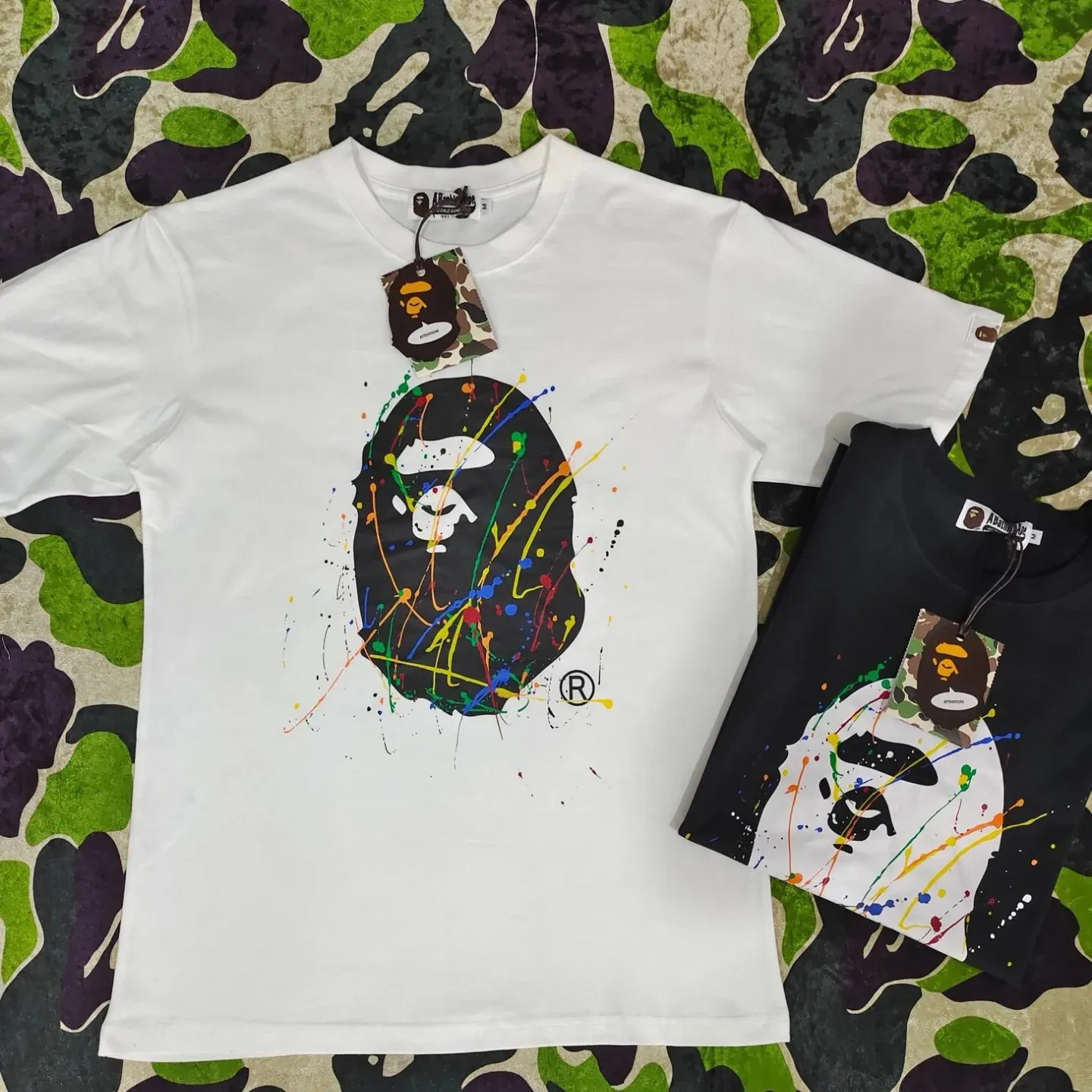 P110 001088 BAPE Paint Splatter Ape Head Oversized Tee paint splash graffiti ape print round neck pullover loose short-sleeved T-shirt same style for men and women code number smlxlxxl black white