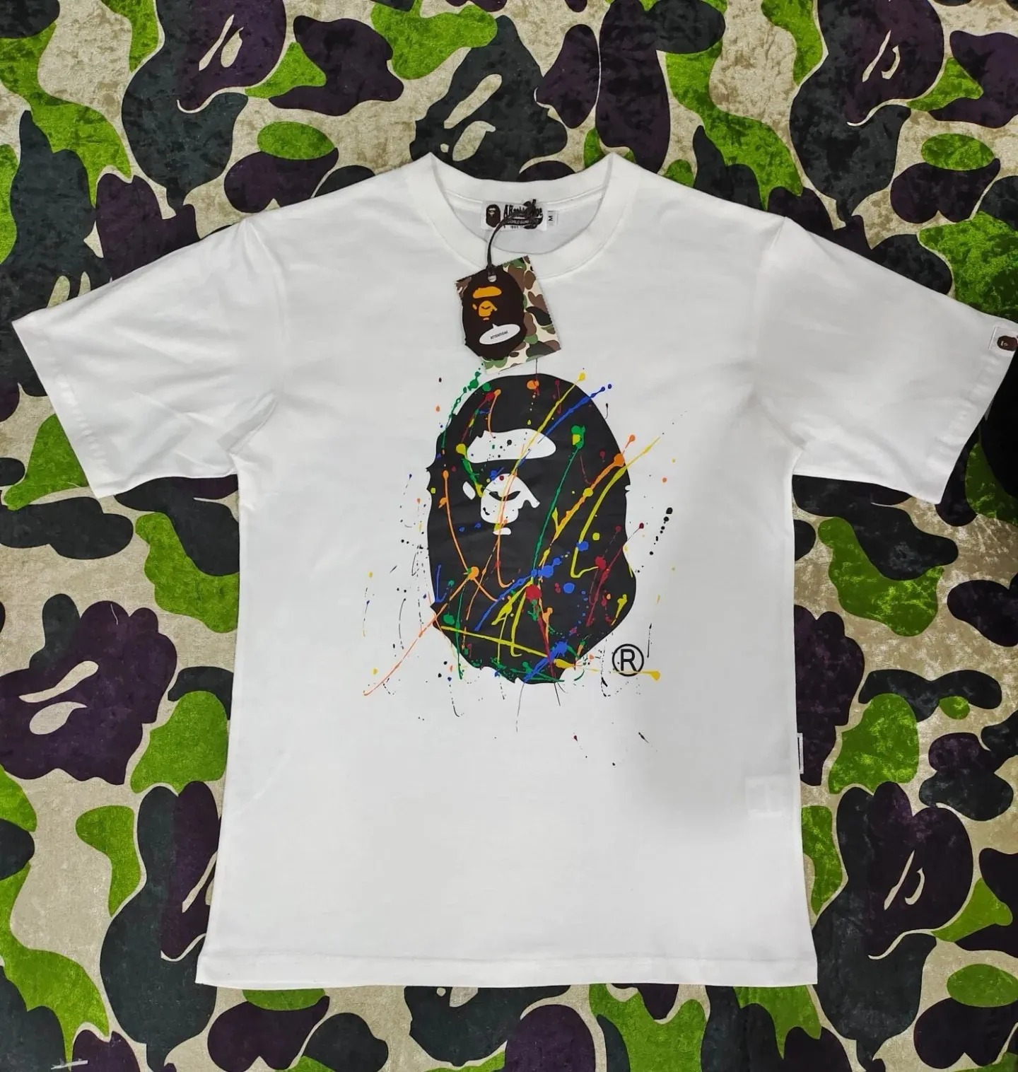 P110 001088 BAPE Paint Splatter Ape Head Oversized Tee paint splash graffiti ape print round neck pullover loose short-sleeved T-shirt same style for men and women code number smlxlxxl black white