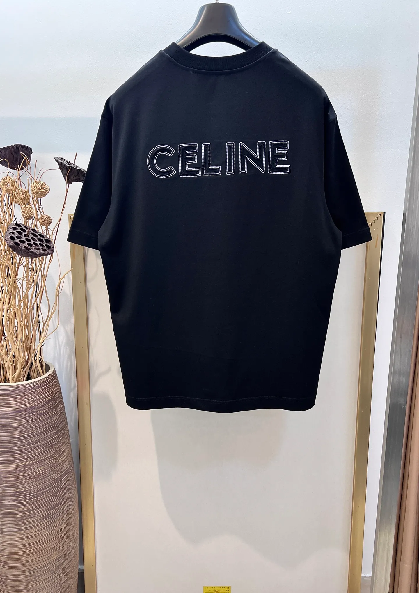 🅿️230 🌈Size: s/m/l/xl Wide version in black and white, same style for men and women 1973538250081 Celi*e/Celine 2025FW Spring and Summer Series Hollow embroidered three-dimensional destruction of logo letters Heavy cotton with loose fit half-sleeved T-shirt Washing method: Dry clean or wrap it in a laundry bag and wash it separately and iron the reverse side at medium temperature! Do not soak/wash in warm water!