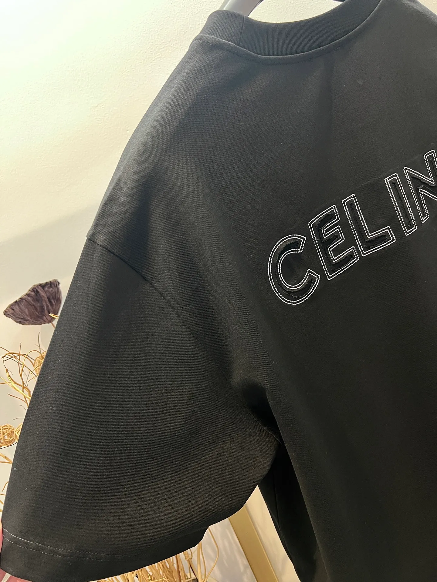 🅿️230 🌈Size: s/m/l/xl Wide version in black and white, same style for men and women 1973538250081 Celi*e/Celine 2025FW Spring and Summer Series Hollow embroidered three-dimensional destruction of logo letters Heavy cotton with loose fit half-sleeved T-shirt Washing method: Dry clean or wrap it in a laundry bag and wash it separately and iron the reverse side at medium temperature! Do not soak/wash in warm water!