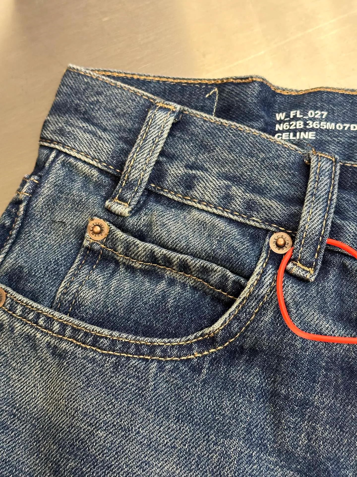 🅿️570 Celine washed bootcut jeans, custom-made with premium textured bias-cut 100% cotton cow silk fabric, classic blue tone intertwined with gradient matte white, perfectly fit the body shape, showing charming curves when walking.  The whisker rubbing technique is combined with the whisker gun painting technique. Manual rubbing is performed on specific areas first to achieve a natural wrinkle effect, and then specific tools are used to draw the whisker-shaped texture to create a full visual effect.  The heavy washing and whitening process uses physical and chemical means to perform multiple deep treatments on the denim fabric to give the surface of the clothing a dark effect. The denim fabric is then machine-polished to produce a wear effect on the surface of the clothing. The holes are exposed using the rotten edge hanging technology, which uses physical wear and friction on the edges to achieve a natural rotten edge effect. The combination of high-temperature steam and sandpaper removes fiber hairiness and color difference, giving the jeans a unique hole and wear effect. size:28.29.30.31