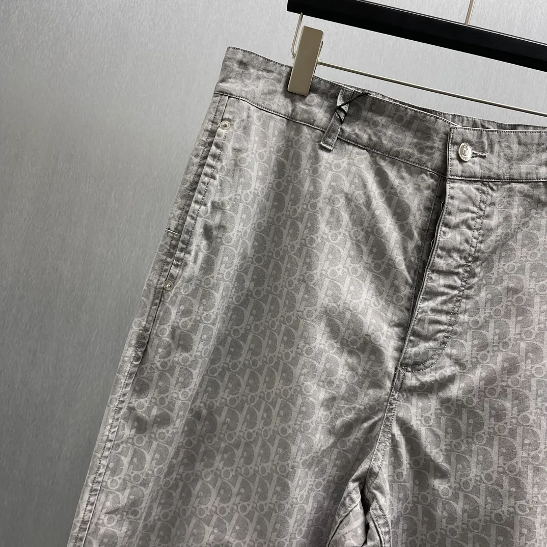 🅿️510 🧧CD Gray Cotton Denim Oblique Print Pants These work jeans display Oblique print, reinterpreting workwear style with a casual cut. Crafted from gray cotton denim and finished with classic . Blique print for an elegant look. Pair with the matching village shirt for a graphic look.