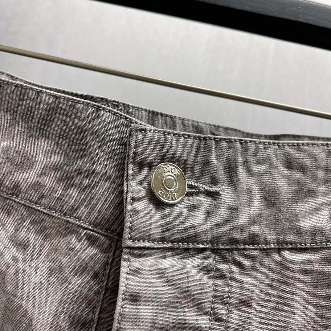 🅿️510 🧧CD Gray Cotton Denim Oblique Print Pants These work jeans display Oblique print, reinterpreting workwear style with a casual cut. Crafted from gray cotton denim and finished with classic . Blique print for an elegant look. Pair with the matching village shirt for a graphic look.