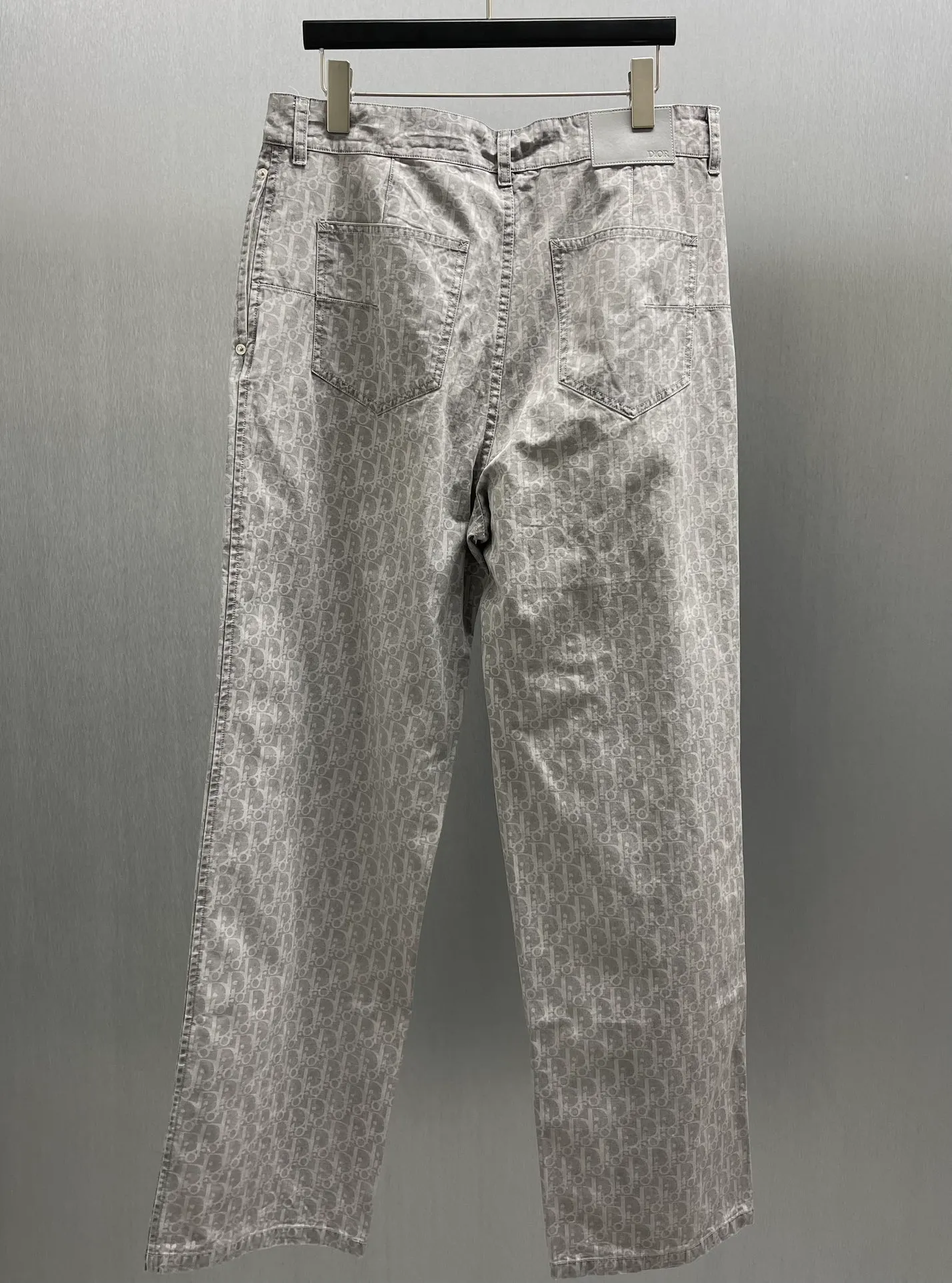 🅿️510 🧧CD Gray Cotton Denim Oblique Print Pants These work jeans display Oblique print, reinterpreting workwear style with a casual cut. Crafted from gray cotton denim and finished with classic . Blique print for an elegant look. Pair with the matching village shirt for a graphic look.