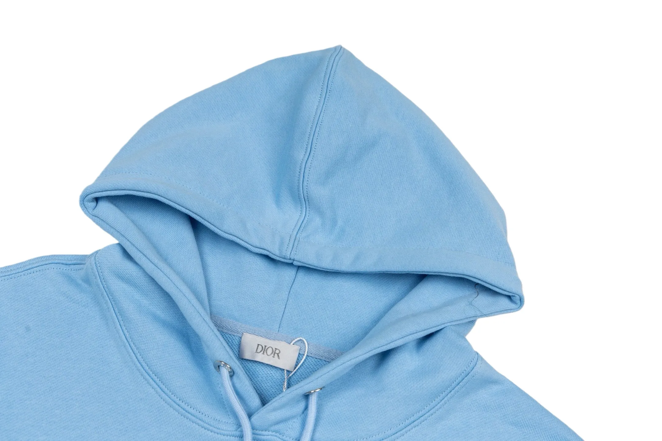 🅿️360 CD Logo Embroidered Hooded Sweatshirt (Blue) Original purchase and development for 3,599. The fabric is made of high-quality blue cotton fleece fabric, soft and comfortable to the touch. The delicate tonal CD Icon embroidery on the chest is low-key and elegant, highlighting the brand details. The drawstring hood design is paired with metal accessories engraved with the Dior logo to enhance the overall texture. The practical kangaroo pocket on the front is as beautiful as it is practical. Ribbed cuffs and hem ensure comfort while maintaining a structured silhouette. 100% cotton material brings excellent breathability and skin-friendly experience. The regular fit has a neat cut and is easy to match with a variety of bottoms. Exquisite embroidery technology and delicate fabric processing complement each other, reflecting Dior's consistent meticulous workmanship. This sweatshirt is the perfect blend of athleisure and haute couture, making it ideal for everyday style. Size:S-M-L-XL