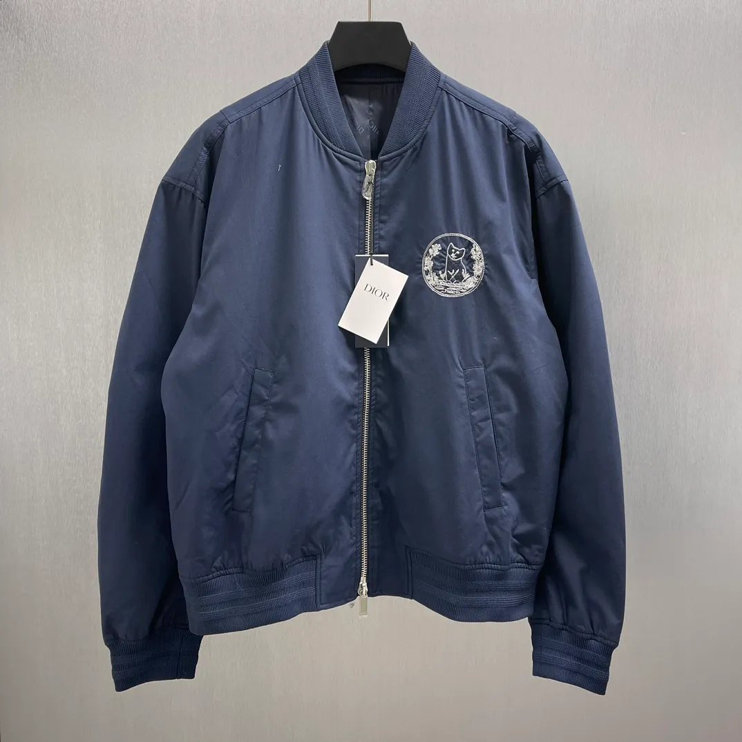 🅿️700 🧧CD Star Embroidered Bomber Jacket SIZE: S-XL This bomber jacket displays the Dior For My Real Friends logo from the DIOR AND HYLTON NEL collaboration. Crafted from navy cotton-blend in a comfortable fit with ribbed trim and welt pockets, it's embroidered with the collection's signature on the front and back. Wear it with a variety of everyday outfits.