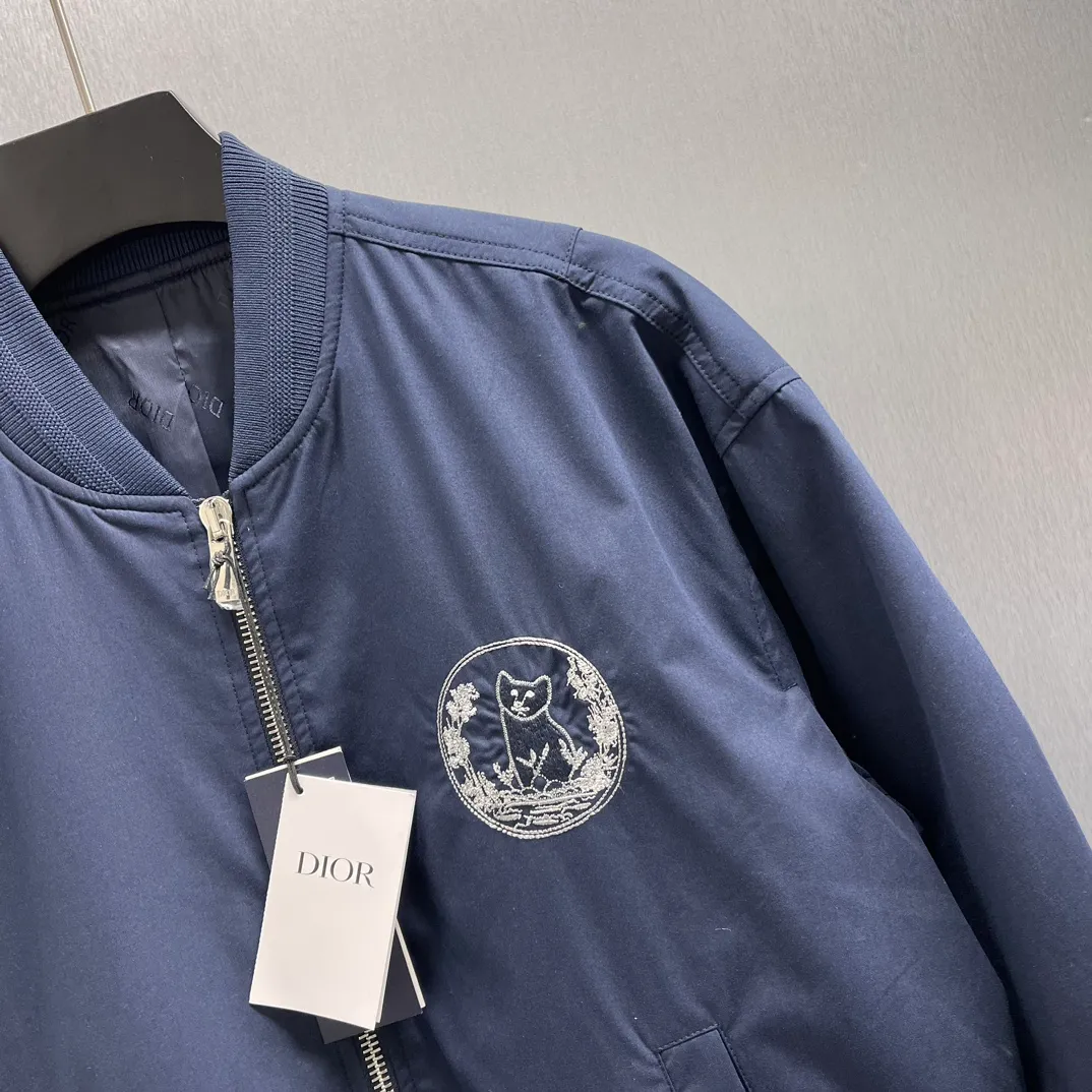 🅿️700 🧧CD Star Embroidered Bomber Jacket SIZE: S-XL This bomber jacket displays the Dior For My Real Friends logo from the DIOR AND HYLTON NEL collaboration. Crafted from navy cotton-blend in a comfortable fit with ribbed trim and welt pockets, it's embroidered with the collection's signature on the front and back. Wear it with a variety of everyday outfits.