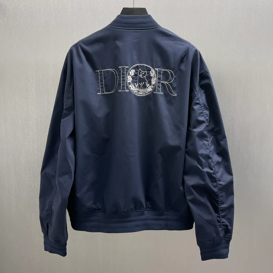 🅿️700 🧧CD Star Embroidered Bomber Jacket SIZE: S-XL This bomber jacket displays the Dior For My Real Friends logo from the DIOR AND HYLTON NEL collaboration. Crafted from navy cotton-blend in a comfortable fit with ribbed trim and welt pockets, it's embroidered with the collection's signature on the front and back. Wear it with a variety of everyday outfits.