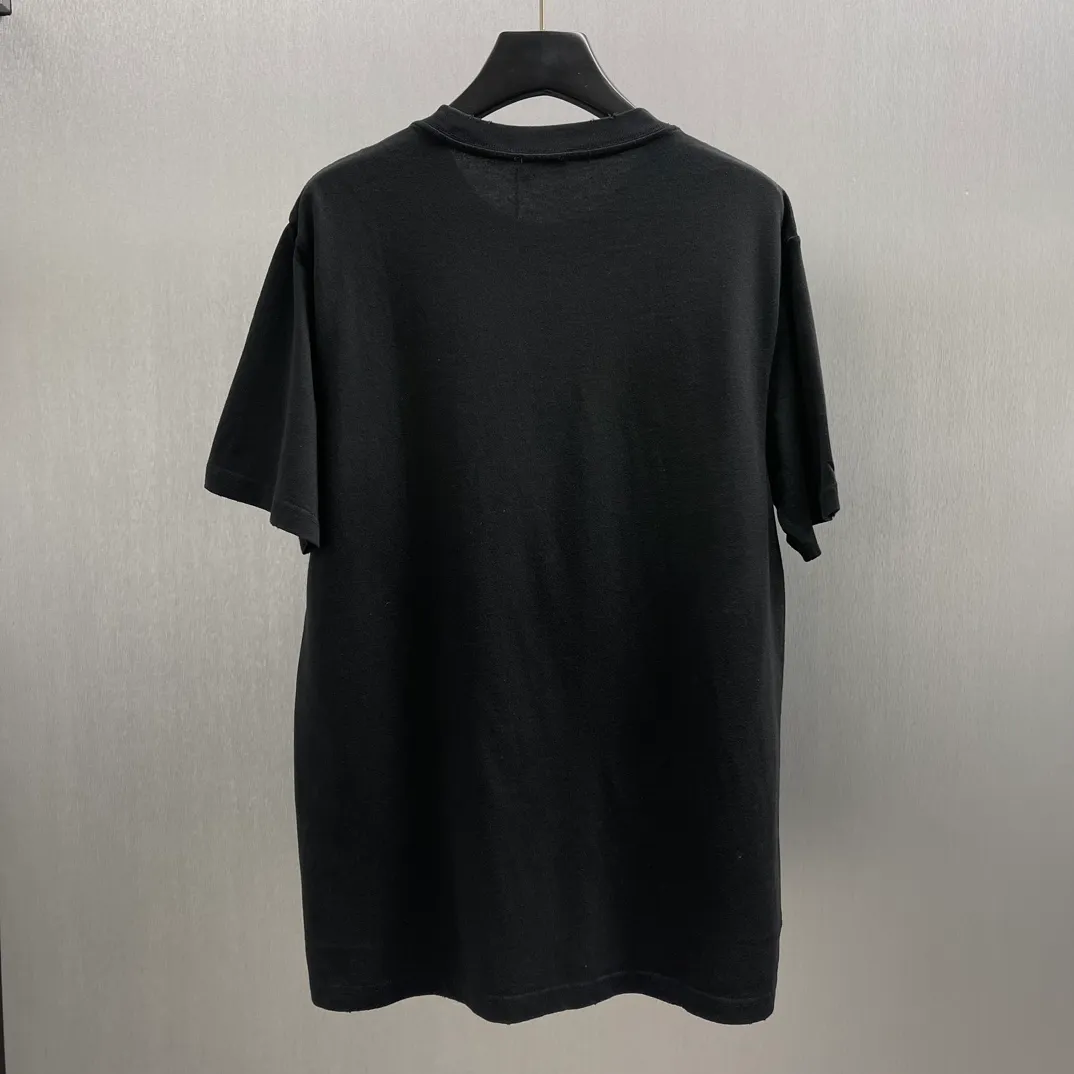 🅿️260 🧧CD True Friends Private Lettered Short Sleeves Size: S-XL This T-shirt displays the Dior For My Real Friends logo from the DIOR AND HYLTON NEL joint series. Crafted from black cotton jersey, it features a classic silhouette with a ribbed crew neck, embroidery on the chest for added style, and a burned-out effect on the collar, sleeves and hem. Cut for a relaxed fit, wear it with track pants or jeans.