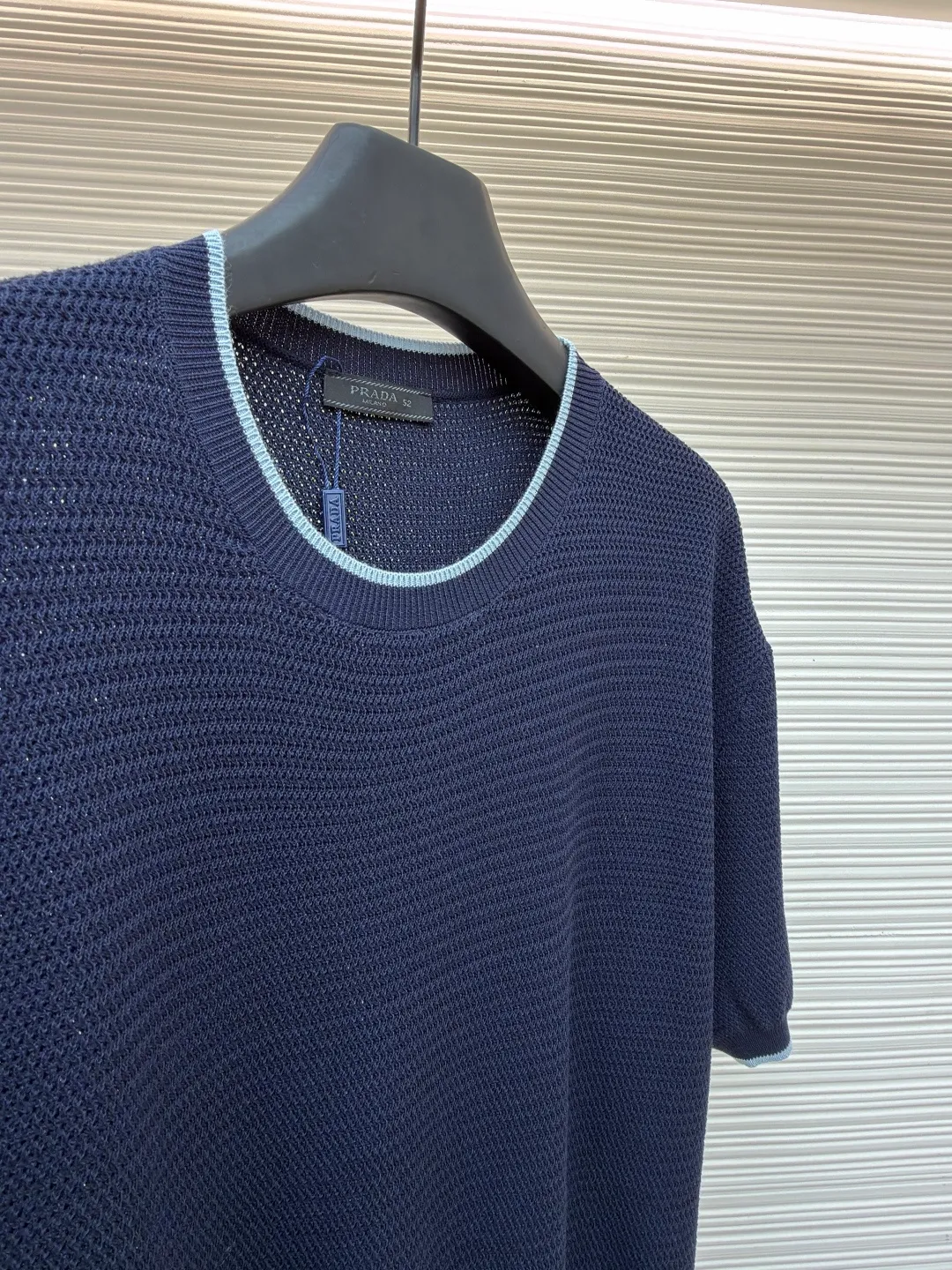 Prada letter logo sweater ●Original version: Purchased and developed for 13800 ●Item number: 1682372-A45 ●Fabric: ice silk wool fabric ●Technology: knitted production ●Color: navy blue ●Version: fitted version ●Weight: about 335 grams ●Size: 48-50-52-54 ●Description: Custom-woven, custom-dyed, luxurious and ultra-fine ice silk wool, soft and silky, comfortable and skin-friendly The main color is deep navy blue, with a touch of smart light blue edges, injecting a sense of agility. The hem of the body is embellished with the Prada letter logo, adding brand recognition. Pure lines are used to outline a simple outline, breaking the monotony in a concise way, showing a luxurious texture in a low-key manner. Imported machine embroidery technology, computer control system and precision mechanical components are used to realize the Prada logo embroidery operation with high precision and smooth and delicate lines. The curved thread structure changes the stitching and yarn arrangement during the knitting process to create a curved distribution of yarns in the fabric. The garment washing water is softened and deodorized. Professional washing equipment and specific detergents are used to deeply clean and deodorize the clothes to improve the feel and appearance of the clothes. The overall wiring is straight and delicate, the fabric is comfortable and soft, and the color is consistent without color difference. It can be matched with the same style to create a fashionable look and control various occasions. Customized accessories, complete with three standards, same style for men and women!