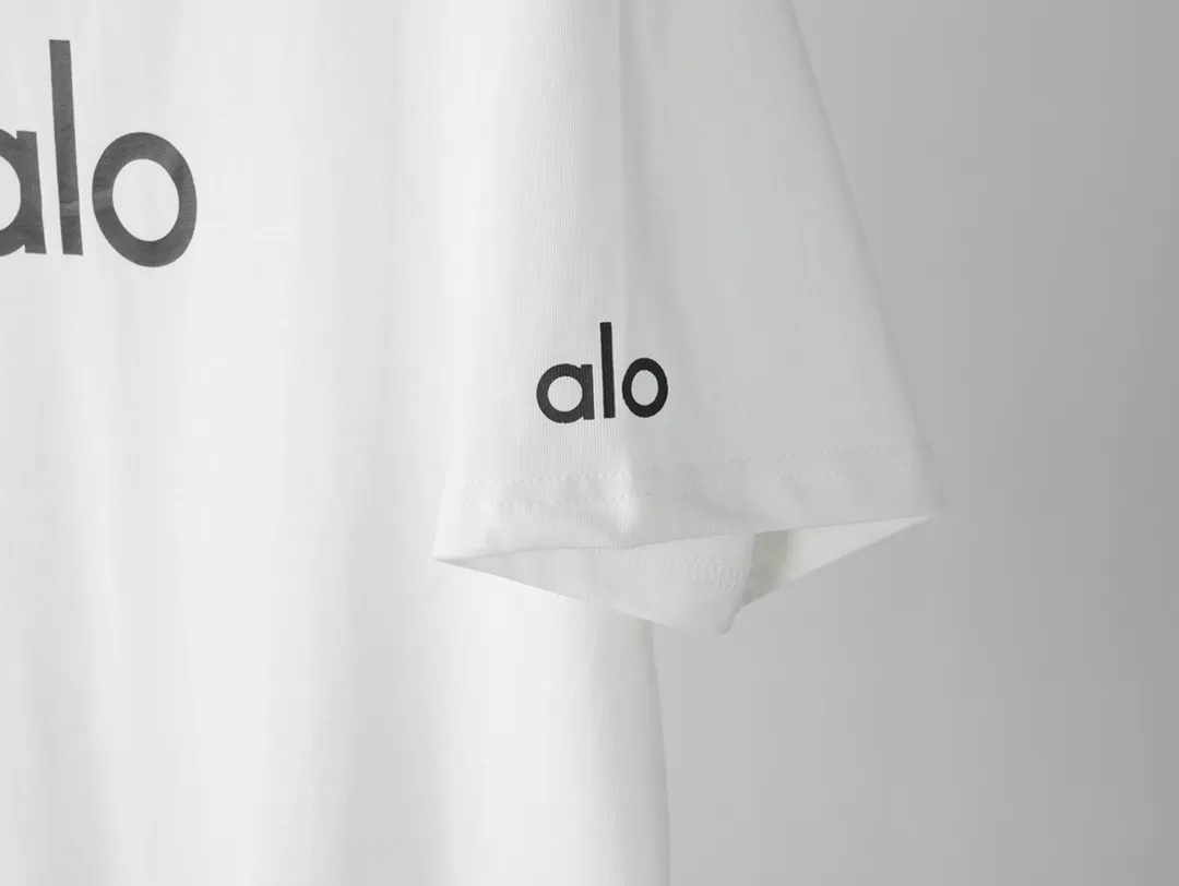 🅿️180 "alo1" Alo 2025ss letter printed logo simple short-sleeved T-shirt. Purchase the original version and develop it. Imported slurry. Can be washed casually without any deformation. Guaranteed not to fade or crack. Fine printing. Made of 280g combed cotton double yarn fabric. Fixed dyeing with 0 color difference. Same cylinder frame thread. 2 washes. Excellent hand feel. Customized original 6 hang tags and a full set of accessories. Invincible details. Distinguish junk version. Only high-end. -Color: white black -Size: xs ~ l