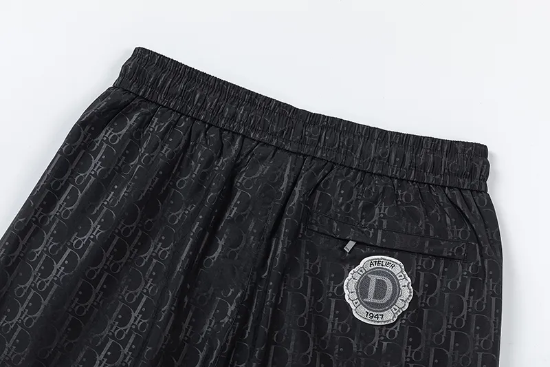 🅿️210 DiOr Dior 2025 Spring and Summer Logo printed all over. New fashionable beach shorts, with lining and mesh shorts! The official website is synchronized with the original 1-1 replica, the original hardware is selected from high-quality polyester fiber fabrics, with a delicate feel, a must-have item for summer, and the upper body effect is super handsome! Color: Black Size: S M L XL XXL