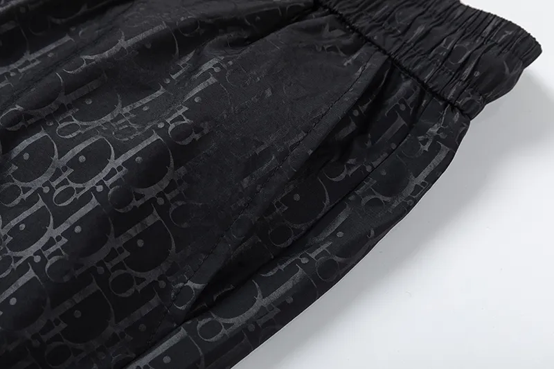 🅿️210 DiOr Dior 2025 Spring and Summer Logo printed all over. New fashionable beach shorts, with lining and mesh shorts! The official website is synchronized with the original 1-1 replica, the original hardware is selected from high-quality polyester fiber fabrics, with a delicate feel, a must-have item for summer, and the upper body effect is super handsome! Color: Black Size: S M L XL XXL