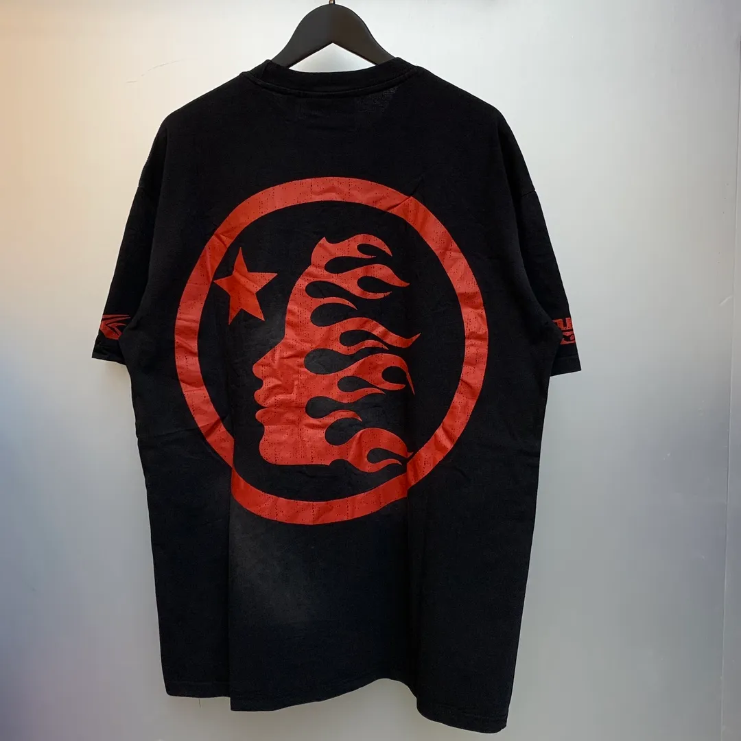 P134 Hellstar Beat Us! T-Shirt Custom Cut and sew garment manufactured in Los Angeles. Dyed and potassium sprayed with jumbo screen print. Fits slightly oversized. Gentle wash tumble dry. Dry clean preferred Newly popular Hellstar short-sleeved T-shirt!   Standard beauty and trendy workmanship, original customization (fabric, pattern, printing, hang tag, main mark, etc.), exaggerated style, explosive style, dare to break through tradition, bring adventurous new fashion experience!  YoungBoy, the most popular rapper in the youth circle, has shot a lot of models for him, and celebrities such as Dababy and Swae Lee frequently get dressed!  color: Vintage Black (washed black)