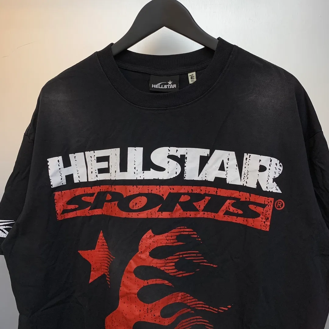 P134 Hellstar Family Tee( T-shirt) Custom Cut and sew garment manufactured in Los Angeles. Dyed and potassium sprayed with jumbo screen print. Fits slightly oversized. Gentle wash tumble dry. Dry clean preferred Newly popular and trendy Hellstar short-sleeved T-shirt!   Standard beauty and trendy workmanship, original customization (fabric, pattern, printing, hang tag, main mark, etc.), exaggerated style, explosive style, dare to break through tradition, bring adventurous new fashion experience!  YoungBoy, the most popular rapper in the youth circle, has shot a lot of models for him, and celebrities such as Dababy and Swae Lee frequently get dressed!  color: Vintage Black (washed black)