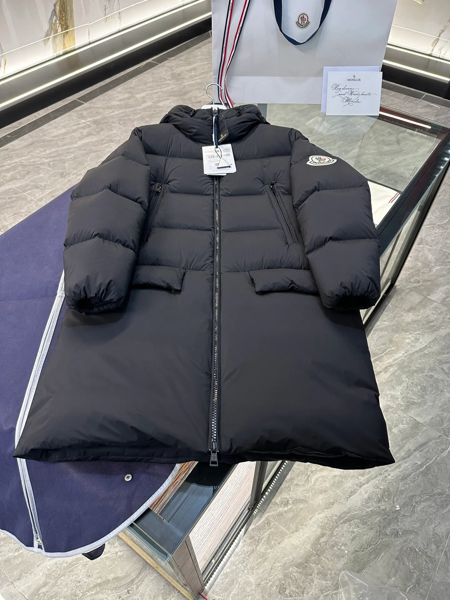 P1120 Moncler Bosona mid-length large felt badge down jacket. More details shot.