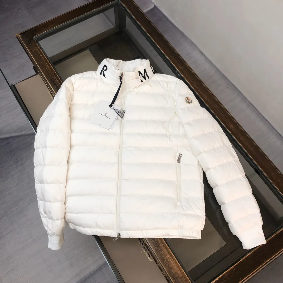 P820 ​​White real shot ✦ MONCLER Men's and Women's Unisex Stand Collar Down Jacket (hidden hood) is now on sale at the counter! New styles of down are available for autumn and winter 💥 New styles are emerging in an endless stream, with heavy embroidery of English letters on the collar, custom thread design on the cuffs, 90 white duck down, ultra-fine tailoring, and the accessories and hardware are also meticulous. We just want to bring good products to everyone 😎 Color: black white Size: 1-5 (M ~ 3XL)