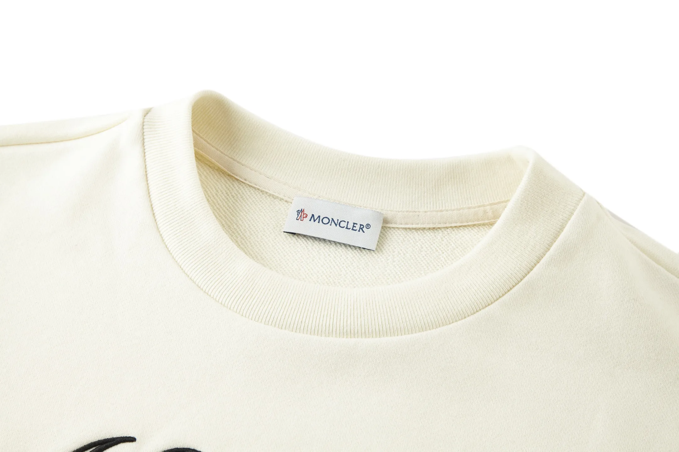 P360 MONCLER Covered Mouth Embroidered Armband Sweatshirt Fabric: Made of 380g brushed sweatshirt terry, the fabric is brushed to make the surface feel softer and smoother. The thread is matched with 1*1 double yarn thread.  Craftsmanship: Embroidery uses 3D multi-dimensional embroidery, embellished with connected brand embroidered letters. The armband is made of sheepskin composite embroidery technology.  Made from soft cotton fleece, this sweatshirt is suitable for all seasons. Round neck design, embellished with logo embroidery, inspired by college baseball uniforms. Round neck made of cotton fleece fabric Logo embossed and embroidered Accessories: Customized 1:1 washed logo Accessories: Customized 1:1 embroidered armband Craftsmanship: Customized 1:1 three-dimensional embroidery Size: S-M-L-XL Color: Black-Apricot