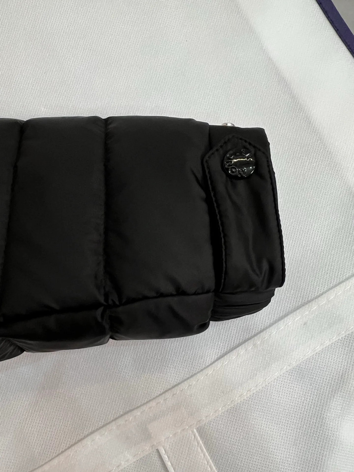 The P780 Arnique hooded down jacket with polyester outer fabric is Moncler's classic men's design.