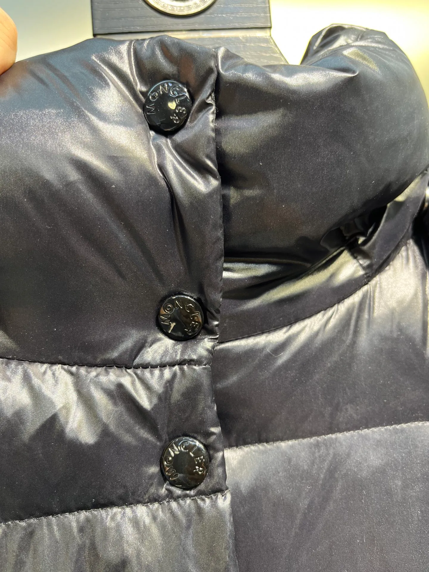 moncler Cavettaz features classic shapes and checkered quilting for a simple yet sharp aesthetic. This long piece is made from lon laqué fabric, giving it the instantly recognizable signature of the brand.  size: 1234