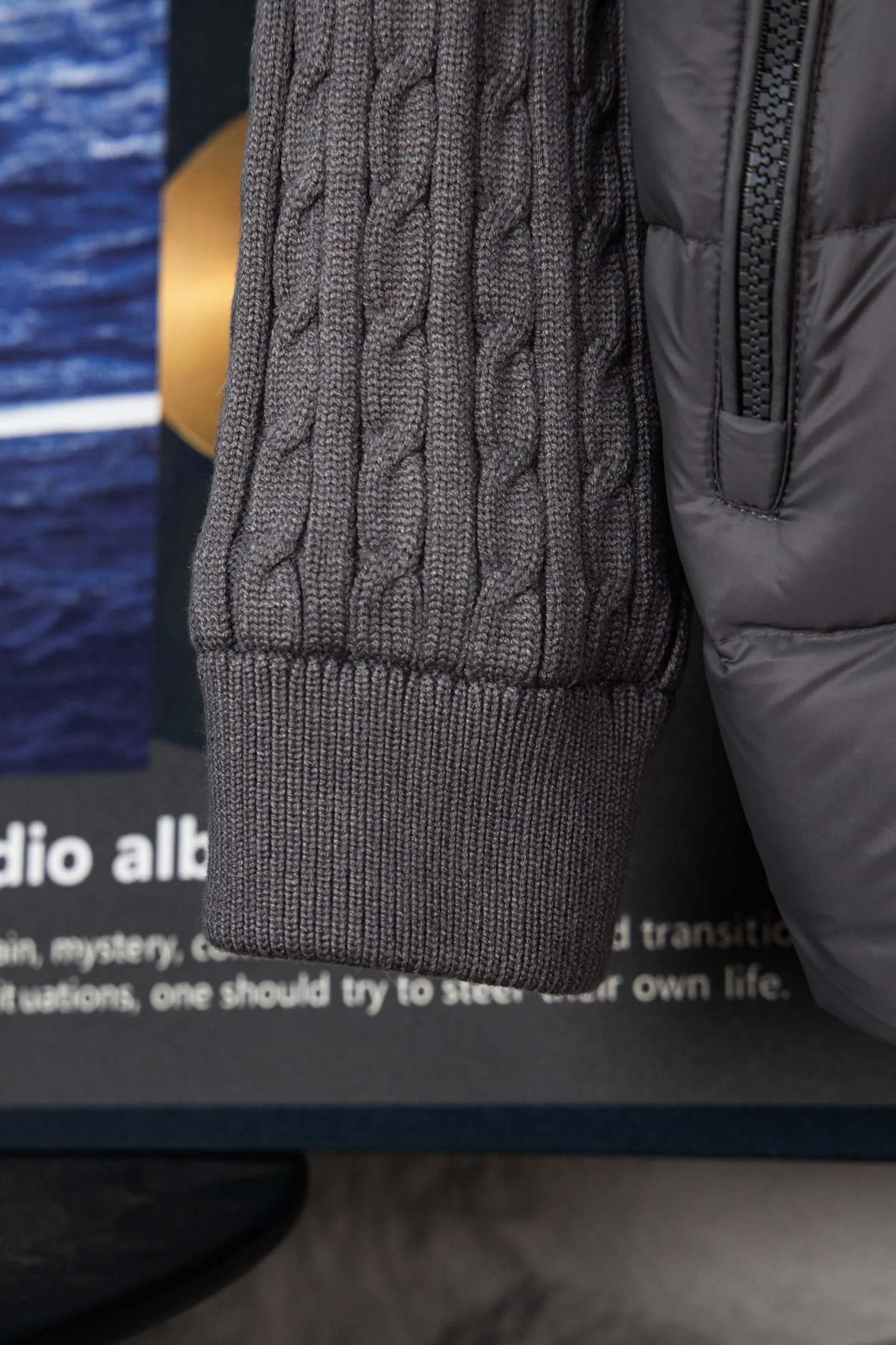 P620 Premium Edition Moncler Cardigan Men's Down Padded Wool and Cashmere Zip Cardigan. Made from a luxurious wool and cashmere blend, this men's padded cardigan can be worn as an outer layer in warmer weather. Packaging Updated (This cardigan is made from wool and cashmere and filled with warm down. It has a zippered silhouette and a knitted turtleneck for extra protection from the elements. A lightweight knit piece with soft leather trim. Details Made from a wool and cashmere blend •Micro chic nylon lining •Down-filled front •Double knit •12 gauge •Zip closure •Zipper pocket •Fleece felt patch logo Size: 1-5. Black Gray