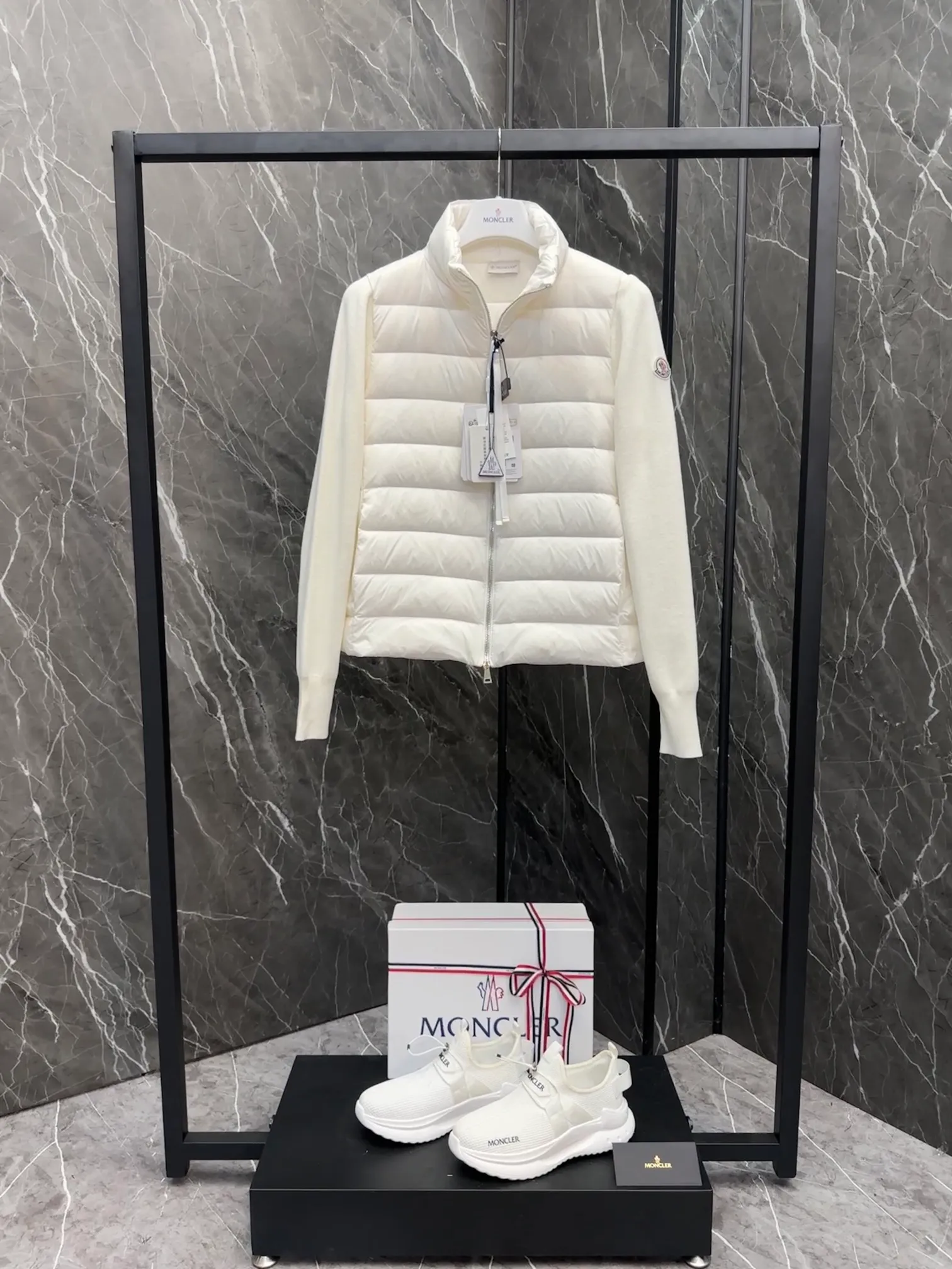 P660 New in Down⬆️Moncler Cardigan Women's Lightly Padded Wool Down Cardigan Jacket. This women's wool cardigan is filled with down and is suitable for all seasons.  This cardigan is a classic Moncler design that can be worn on its own when the weather is nice, or paired with jackets and coats when the weather cools down. Wool knit style with down-filled front for warmth and protection. Details Made of fine wool and nylon léger brillant •Nylon léger brillant lining •Down filling •Jersey knit •14 gauge •Zip closure •Zip pockets Size : 1-3 Black White