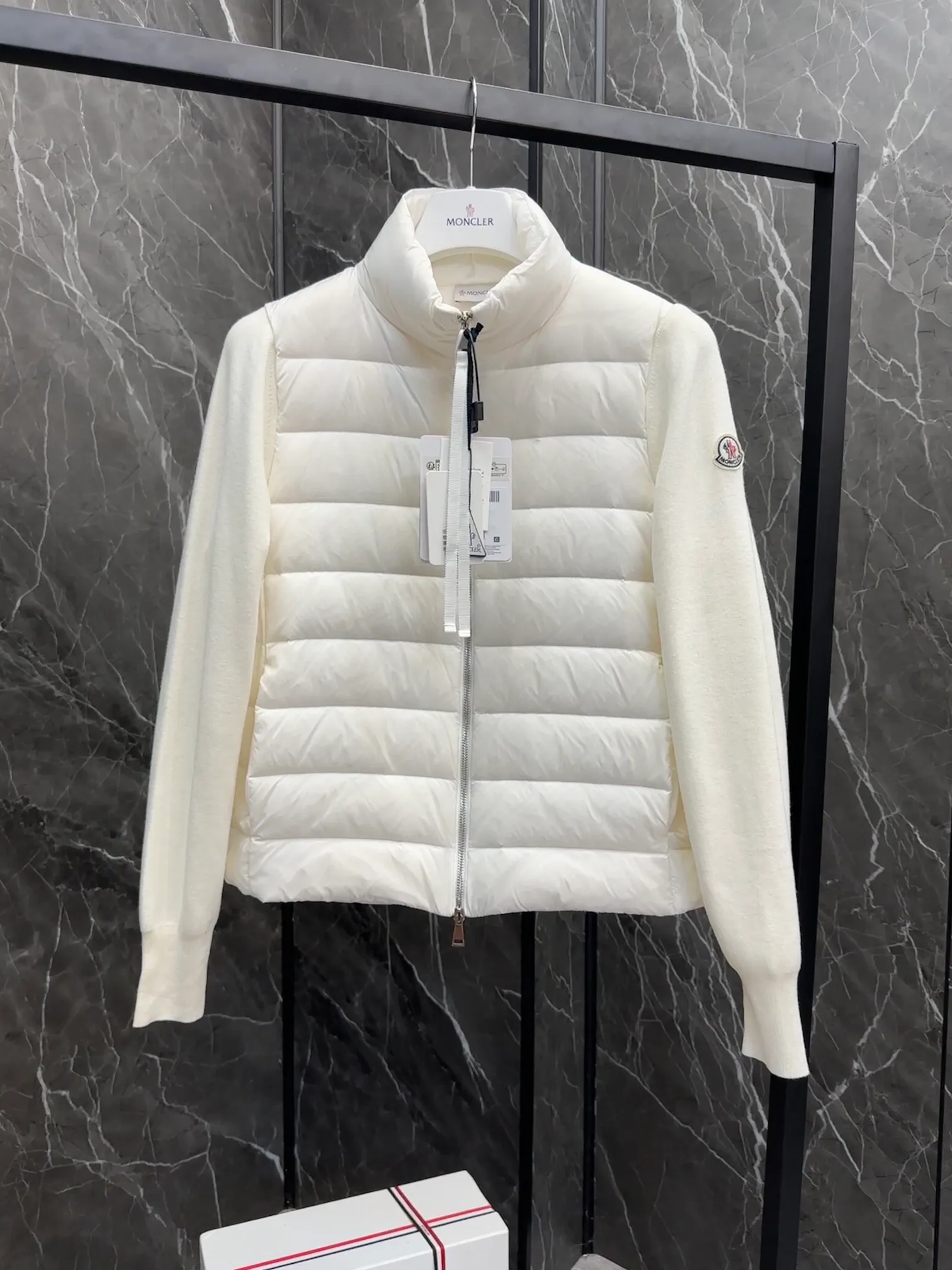 P660 New in Down⬆️Moncler Cardigan Women's Lightly Padded Wool Down Cardigan Jacket. This women's wool cardigan is filled with down and is suitable for all seasons.  This cardigan is a classic Moncler design that can be worn on its own when the weather is nice, or paired with jackets and coats when the weather cools down. Wool knit style with down-filled front for warmth and protection. Details Made of fine wool and nylon léger brillant •Nylon léger brillant lining •Down filling •Jersey knit •14 gauge •Zip closure •Zip pockets Size : 1-3 Black White