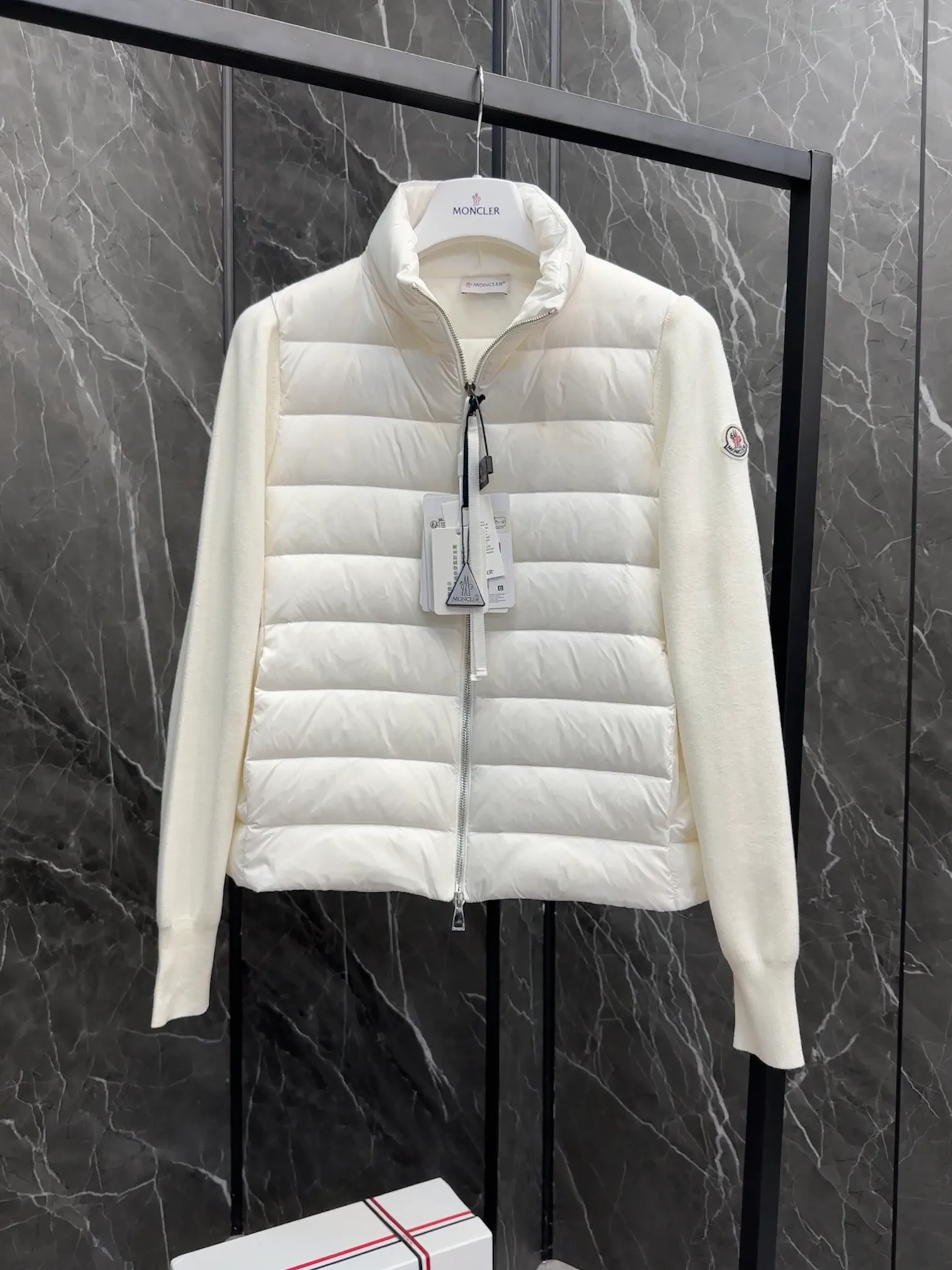 P660 New in Down⬆️Moncler Cardigan Women's Lightly Padded Wool Down Cardigan Jacket. This women's wool cardigan is filled with down and is suitable for all seasons.  This cardigan is a classic Moncler design that can be worn on its own when the weather is nice, or paired with jackets and coats when the weather cools down. Wool knit style with down-filled front for warmth and protection. Details Made of fine wool and nylon léger brillant •Nylon léger brillant lining •Down filling •Jersey knit •14 gauge •Zip closure •Zip pockets Size : 1-3 Black White