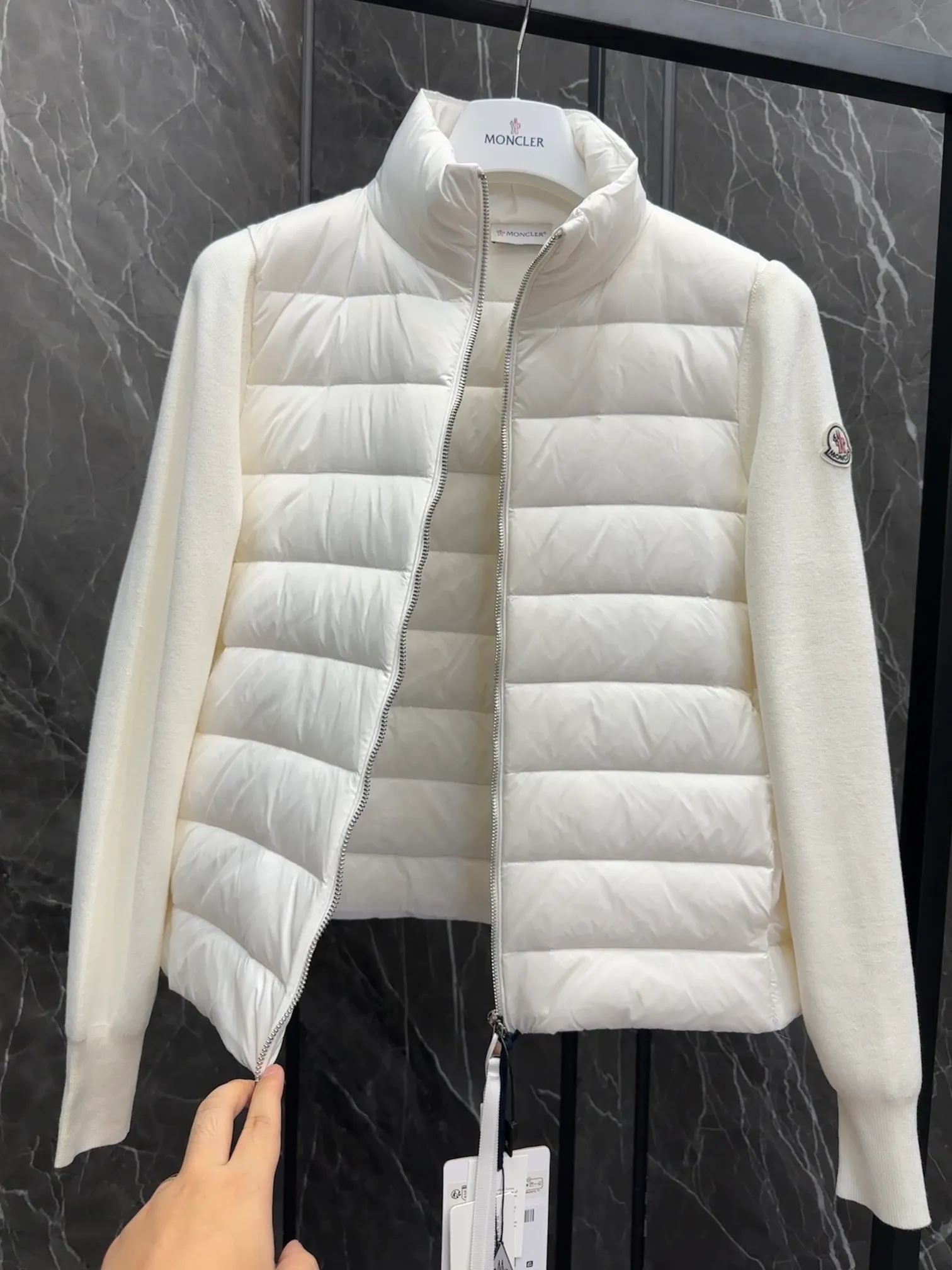 P660 New in Down⬆️Moncler Cardigan Women's Lightly Padded Wool Down Cardigan Jacket. This women's wool cardigan is filled with down and is suitable for all seasons.  This cardigan is a classic Moncler design that can be worn on its own when the weather is nice, or paired with jackets and coats when the weather cools down. Wool knit style with down-filled front for warmth and protection. Details Made of fine wool and nylon léger brillant •Nylon léger brillant lining •Down filling •Jersey knit •14 gauge •Zip closure •Zip pockets Size : 1-3 Black White