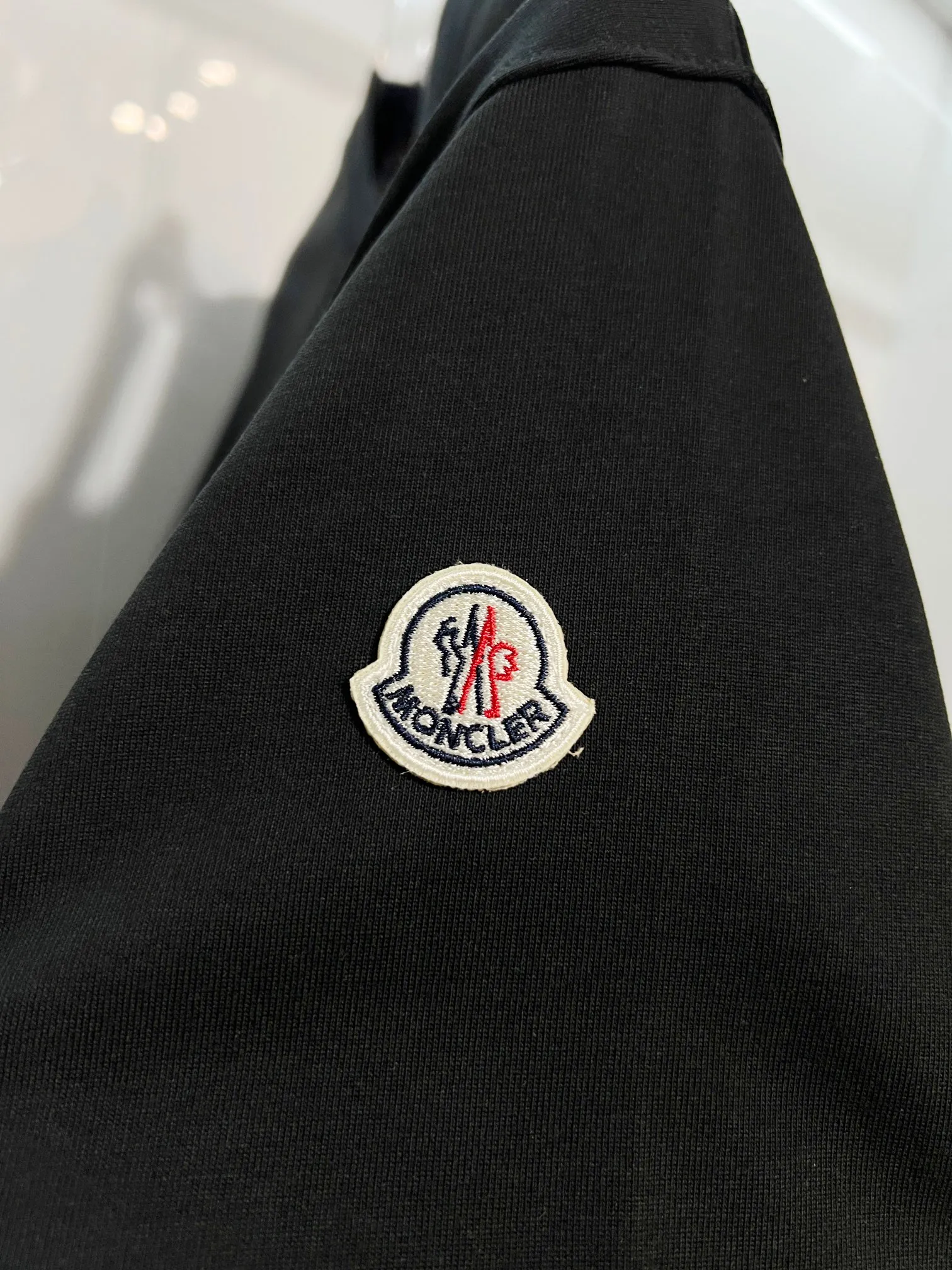 P150 MONCLER/muzzled 300g pure cotton round neck short-sleeved T-shirt. Brand classic. Three-dimensional monster offset letter LOGO embossing process. 2025ss official synchronization. High version. High quality. Fashionable personality. Versatile trend. Pure original quality. Original fabric. Tag. Collar label. Washed wheat. Three labels complete. Color: Black. White. Size: S M L XL XXL