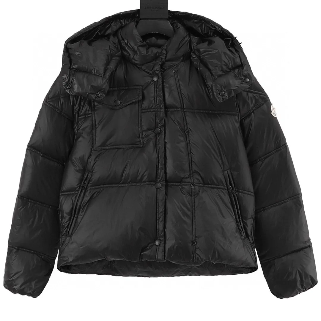 P880 Moncler muzzle women's square quilted hooded short down jacket. Premium goose down filling. Super full filling. The Erea down jacket cleverly uses shape and texture to show modern style. Short design in functional super laqué nylon with a glossy finish. This hooded insulated piece features a double-snap closure for an asymmetrical shape. The body and sleeves are quilted in varying sizes for a geometric feel. Details •Made from super laqué fabric •Nylon lining •Down filled •Removable and adjustable hood •Zip and snap closure •Zip pockets •Snap fastening at chest pocket •Drawstring hem •Style: A100# Color: Black/Cream/Light Green Sizes: 1 2 3 4