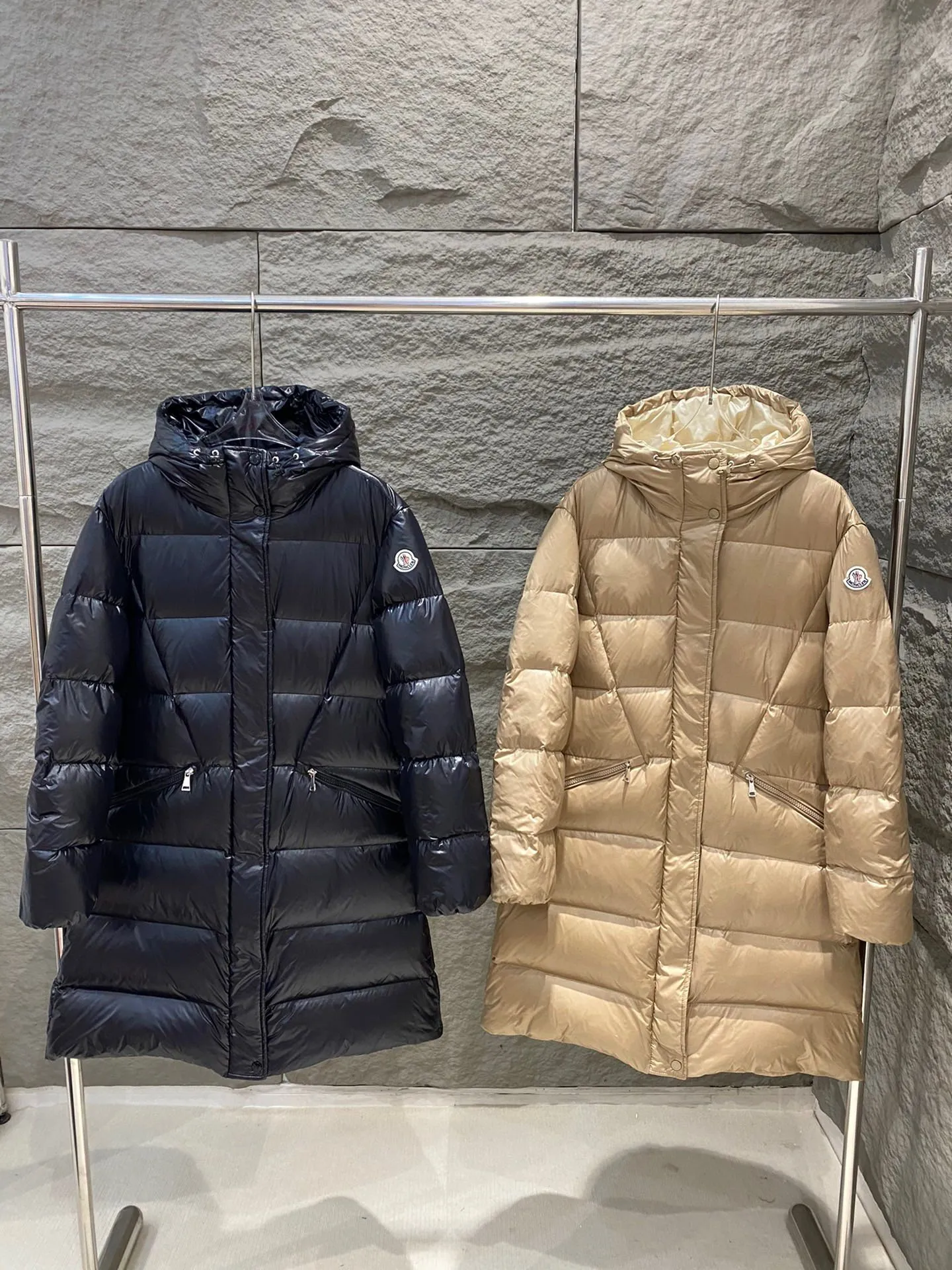 P1180 Moncler Bellevue Women's Long Belted Down Jacket The Bellevue down jacket is made of iconic nylon laqué fabric, interpreting classic Moncler style. Long design, the fabric has been functionally treated for a gorgeous lustrous effect. This hooded thermal piece has a feminine silhouette and an elastic waistband. From day to night, from the city to the mountains, it can be easily handled. Color: black/khaki Size: 0/1/2/3