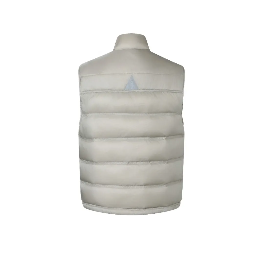 P680 MONCLER down vest with reflective markings Fabric selection: Made of ultra-fine nylon yarn woven in a high-density manner. The number of yarns per unit area is large, and the gaps between the yarns are very small, which can effectively block the penetration of cold wind. The fine weave keeps it lightweight and soft to the touch, physically restricting the lightweight down fibers from slipping through the gaps. Nylon fiber itself has good wear resistance and is not easy to snag, which significantly extends its service life and can easily cope with the needs of multiple scenarios.  Lining selection: The lining is made of 100% polyester fiber high-density weaving. The thickness of 0.08mm avoids increasing the overall weight and makes it smooth to wear. The high-density weaving structure forms a wind resistance layer to protect the thermal efficiency of the thermal insulation layer from loss. At the same time, it can withstand the expansion pressure of down and prevent deformation and damage after long-term use.  High-quality filling: 90 white duck down is selected, with a weight of 130g, ensuring excellent thermal insulation performance. After strict screening and processing, the velvet is not easy to get drilled, ensuring durability.  Process: Through the reflective cloth punching process, the logo is regularly arranged on the triangular reflective mark with dozens of small holes, which not only improves the functionality, but also strengthens the recognition and aesthetics.   Accessories: One-to-one customized snap buttons, one-to-one customized zipper pullers, one-to-one customized badges, one-to-one customized elastic buckles, etc. SIZE: 1 2 3 4