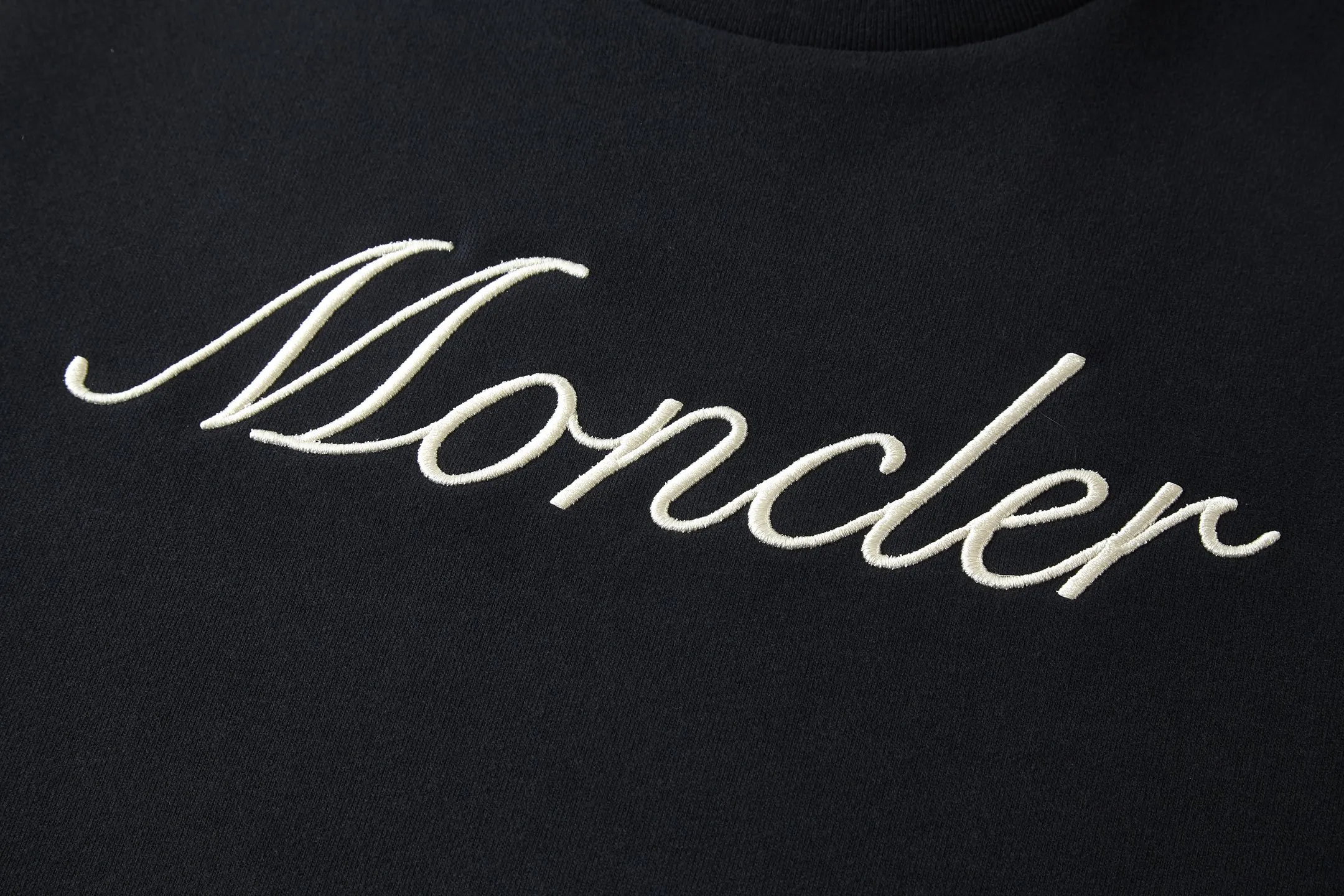 P360 MONCLER Covered Mouth Embroidered Armband Sweatshirt Fabric: Made of 380g brushed sweatshirt terry, the fabric is brushed to make the surface feel softer and smoother. The thread is matched with 1*1 double yarn thread.  Craftsmanship: Embroidery uses 3D multi-dimensional embroidery, embellished with connected brand embroidered letters. The armband is made of sheepskin composite embroidery technology.  Made from soft cotton fleece, this sweatshirt is suitable for all seasons. Round neck design, embellished with logo embroidery, inspired by college baseball uniforms. Round neck made of cotton fleece fabric Logo embossed and embroidered Accessories: Customized 1:1 washed logo Accessories: Customized 1:1 embroidered armband Craftsmanship: Customized 1:1 three-dimensional embroidery Size: S-M-L-XL Color: Black-Apricot