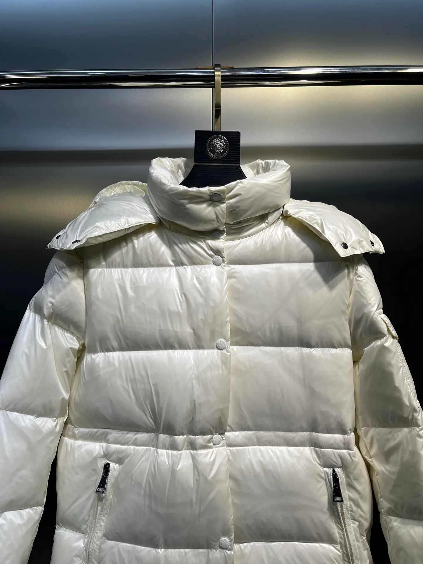 moncler Cavettaz features classic shapes and checkered quilting for a simple yet sharp aesthetic. This long piece is made from lon laqué fabric, giving it the instantly recognizable signature of the brand.  size: 1234