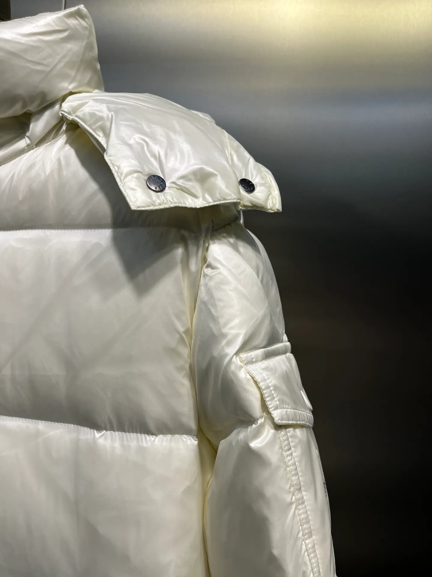 moncler Cavettaz features classic shapes and checkered quilting for a simple yet sharp aesthetic. This long piece is made from lon laqué fabric, giving it the instantly recognizable signature of the brand.  size: 1234