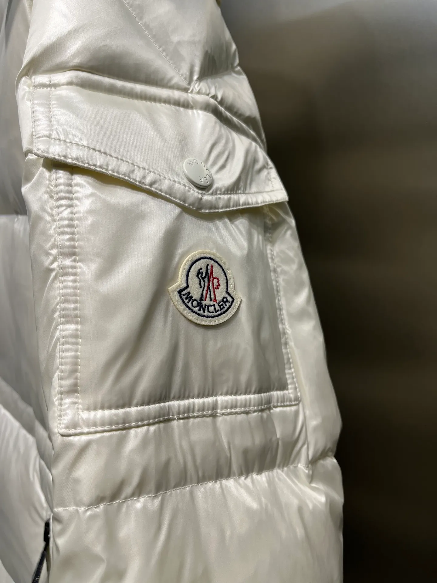 moncler Cavettaz features classic shapes and checkered quilting for a simple yet sharp aesthetic. This long piece is made from lon laqué fabric, giving it the instantly recognizable signature of the brand.  size: 1234