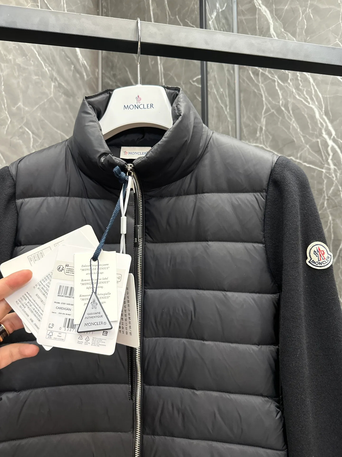 P660 New in Down⬆️Moncler Cardigan Women's Lightly Padded Wool Down Cardigan Jacket. This women's wool cardigan is filled with down and is suitable for all seasons.  This cardigan is a classic Moncler design that can be worn on its own when the weather is nice, or paired with jackets and coats when the weather cools down. Wool knit style with down-filled front for warmth and protection. Details Made of fine wool and nylon léger brillant •Nylon léger brillant lining •Down filling •Jersey knit •14 gauge •Zip closure •Zip pockets Size : 1-3 Black White