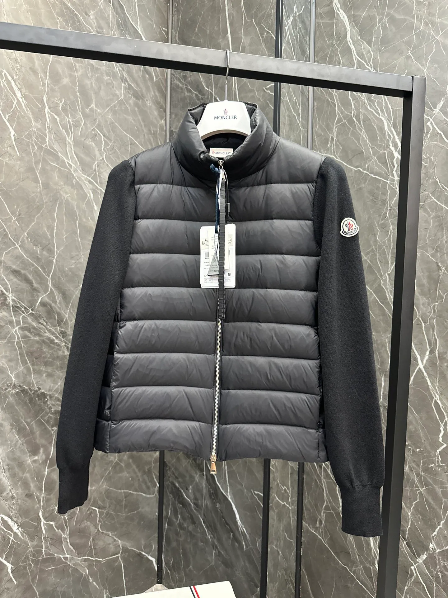 P660 New in Down⬆️Moncler Cardigan Women's Lightly Padded Wool Down Cardigan Jacket. This women's wool cardigan is filled with down and is suitable for all seasons.  This cardigan is a classic Moncler design that can be worn on its own when the weather is nice, or paired with jackets and coats when the weather cools down. Wool knit style with down-filled front for warmth and protection. Details Made of fine wool and nylon léger brillant •Nylon léger brillant lining •Down filling •Jersey knit •14 gauge •Zip closure •Zip pockets Size : 1-3 Black White