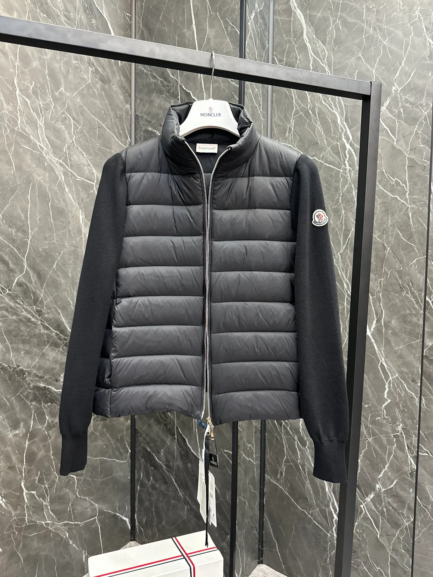 P660 New in Down⬆️Moncler Cardigan Women's Lightly Padded Wool Down Cardigan Jacket. This women's wool cardigan is filled with down and is suitable for all seasons.  This cardigan is a classic Moncler design that can be worn on its own when the weather is nice, or paired with jackets and coats when the weather cools down. Wool knit style with down-filled front for warmth and protection. Details Made of fine wool and nylon léger brillant •Nylon léger brillant lining •Down filling •Jersey knit •14 gauge •Zip closure •Zip pockets Size : 1-3 Black White