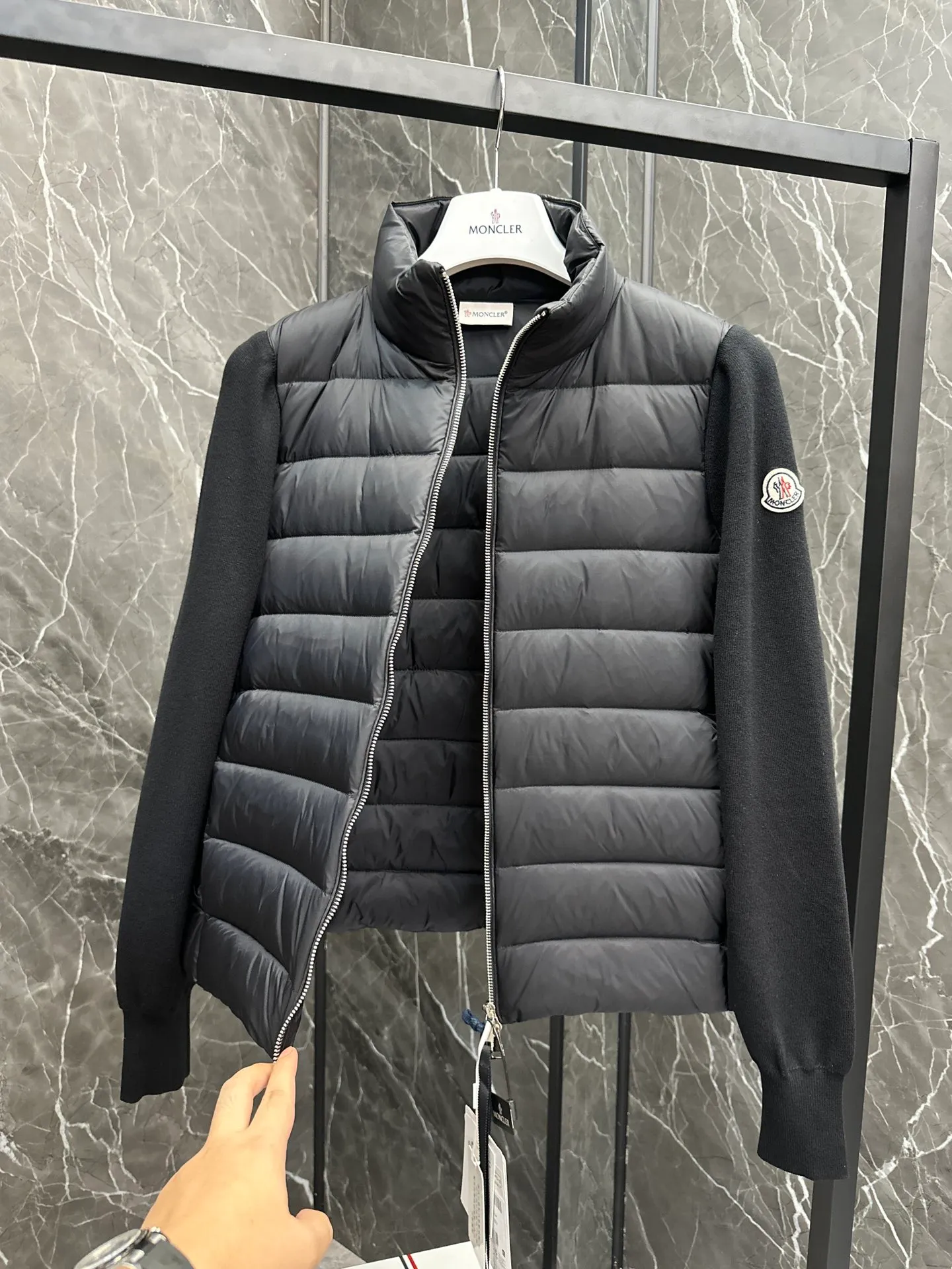 P660 New in Down⬆️Moncler Cardigan Women's Lightly Padded Wool Down Cardigan Jacket. This women's wool cardigan is filled with down and is suitable for all seasons.  This cardigan is a classic Moncler design that can be worn on its own when the weather is nice, or paired with jackets and coats when the weather cools down. Wool knit style with down-filled front for warmth and protection. Details Made of fine wool and nylon léger brillant •Nylon léger brillant lining •Down filling •Jersey knit •14 gauge •Zip closure •Zip pockets Size : 1-3 Black White