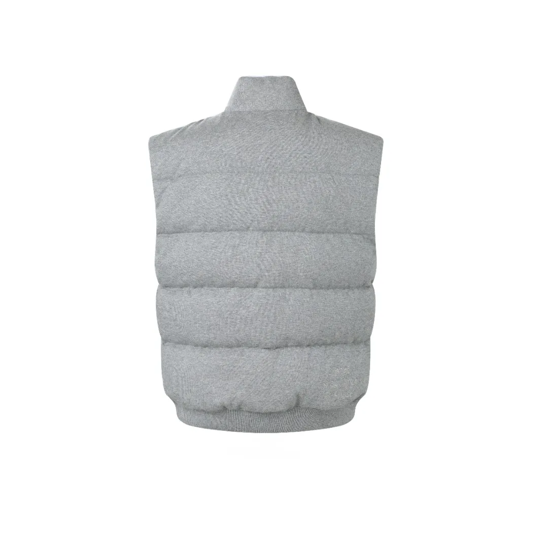 P760 MONCLER cotton embroidered down vest Fabric selection: Lightweight knitted fabric made of 100% cotton fiber. The fiber characteristics are soft to the touch. The knitted structure gives the fabric a certain degree of elasticity in the horizontal and vertical directions. Even though it is a down vest, it can move freely without any sense of restraint. The air circulates freely between the coils and has good breathability. It is not easy to accumulate moisture inside, improving the wearing experience. Lining fabric: The high-density lining is woven with ultra-fine nylon denier, with a thickness of 0.08mm to avoid increasing the overall weight and making it smooth to wear. The high-density woven structure forms a wind resistance layer to protect the thermal efficiency of the thermal layer from loss. It can also withstand the expansion pressure of down and prevent deformation and damage after long-term use.  Process: The high-precision computing system of the computerized embroidery machine controls the coordinated operation of the machine head, needle bar, and bobbin. The fabric frame moves accurately in the horizontal and vertical directions to form a stitch track. The upper and lower thread tensions are adjusted to ensure that the stitches are smooth and free of floating threads. The chest, lower front and lower back panels are decorated with three different letter embroideries. The finished product has clear patterns and no burrs on the edges.  90 national standard high-quality white duck down: Selected high-fill down, with a fill power of 650fp, light and warm, with excellent temperature locking performance and good resilience.  Accessories: One-to-one customized badges, One-to-one customized snaps, One-to-one customized three-label, One-to-one customized zipper pullers SIZE: S M L XL