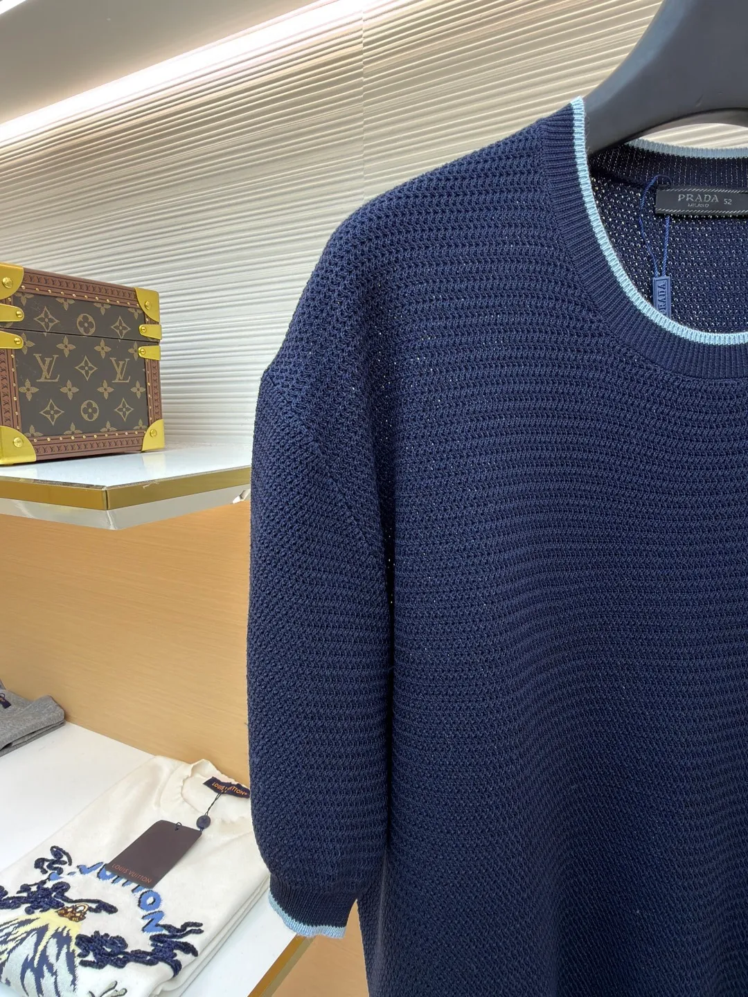 Prada letter logo sweater ●Original version: Purchased and developed for 13800 ●Item number: 1682372-A45 ●Fabric: ice silk wool fabric ●Technology: knitted production ●Color: navy blue ●Version: fitted version ●Weight: about 335 grams ●Size: 48-50-52-54 ●Description: Custom-woven, custom-dyed, luxurious and ultra-fine ice silk wool, soft and silky, comfortable and skin-friendly The main color is deep navy blue, with a touch of smart light blue edges, injecting a sense of agility. The hem of the body is embellished with the Prada letter logo, adding brand recognition. Pure lines are used to outline a simple outline, breaking the monotony in a concise way, showing a luxurious texture in a low-key manner. Imported machine embroidery technology, computer control system and precision mechanical components are used to realize the Prada logo embroidery operation with high precision and smooth and delicate lines. The curved thread structure changes the stitching and yarn arrangement during the knitting process to create a curved distribution of yarns in the fabric. The garment washing water is softened and deodorized. Professional washing equipment and specific detergents are used to deeply clean and deodorize the clothes to improve the feel and appearance of the clothes. The overall wiring is straight and delicate, the fabric is comfortable and soft, and the color is consistent without color difference. It can be matched with the same style to create a fashionable look and control various occasions. Customized accessories, complete with three standards, same style for men and women!