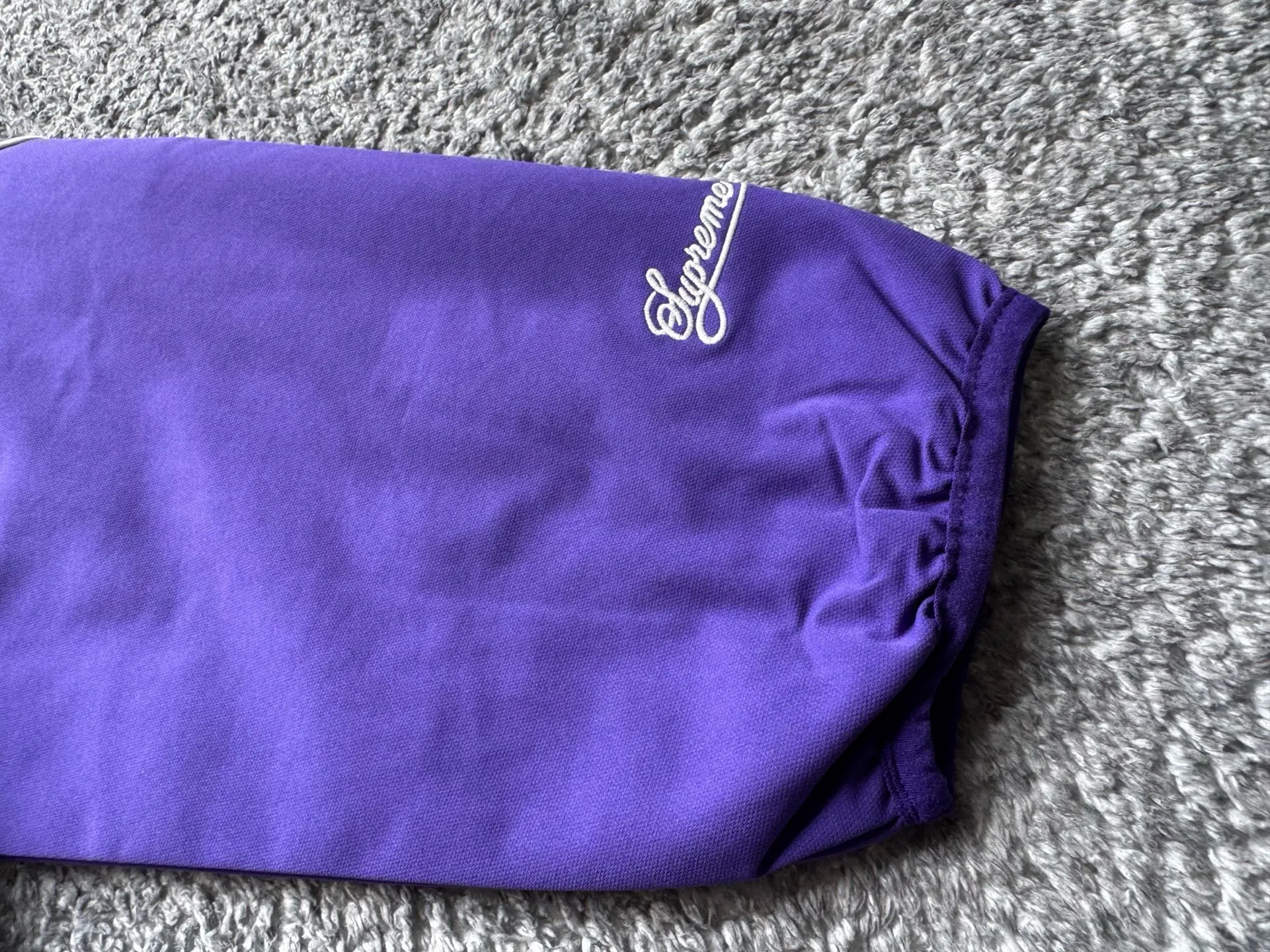 P450 Supreme x Nike joint model SS25 WEEK4 Track Jacket embroidered cuffs logo zipper closure jacket, same style for men and women, original 1:1 customization, customized accessories, all three standards Color: Black Purple Clothing size: S-XL Length Chest Shoulder Width Sleeve Length S 67 137 51.8 77.5 M 69 141 53 79 L 71 145 54.2 80.5 XL 73 149 55.4 81.5