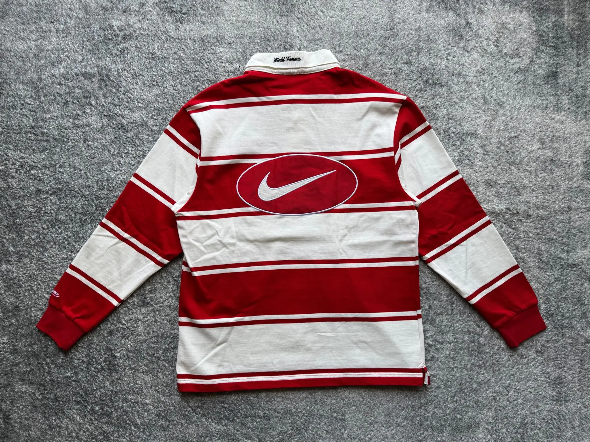 P420 [Original replica] Supreme x Nike joint model Nike joint series SS25 Stripe Rugby logo striped comfortable long-sleeved Polo shirt for men and women Color: black and white white and red Size: S M L XL 79 130 56 64